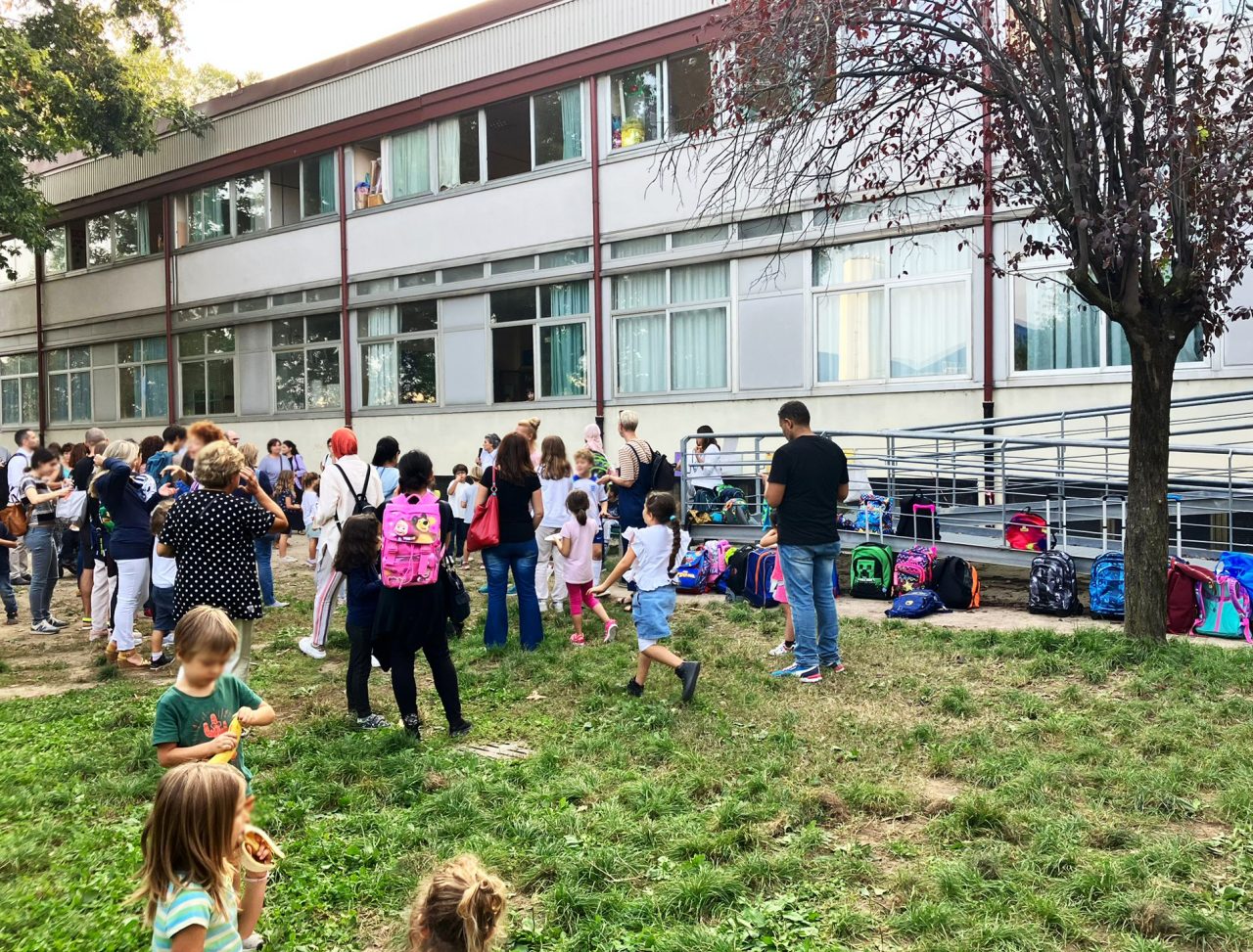 An elementary school garden in Milan, Italy where kids are playing 