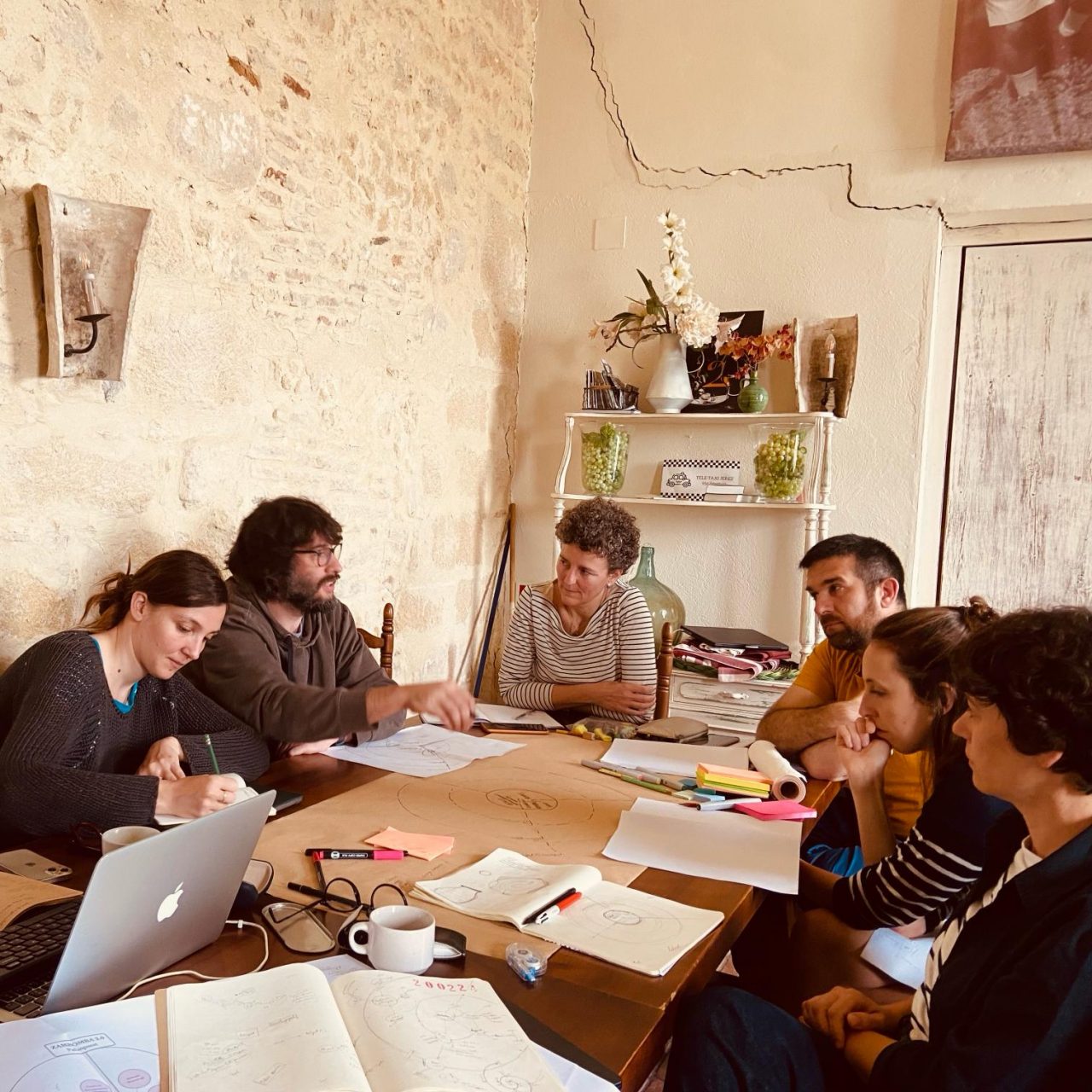 Group of people sitting and working in a cozy environment